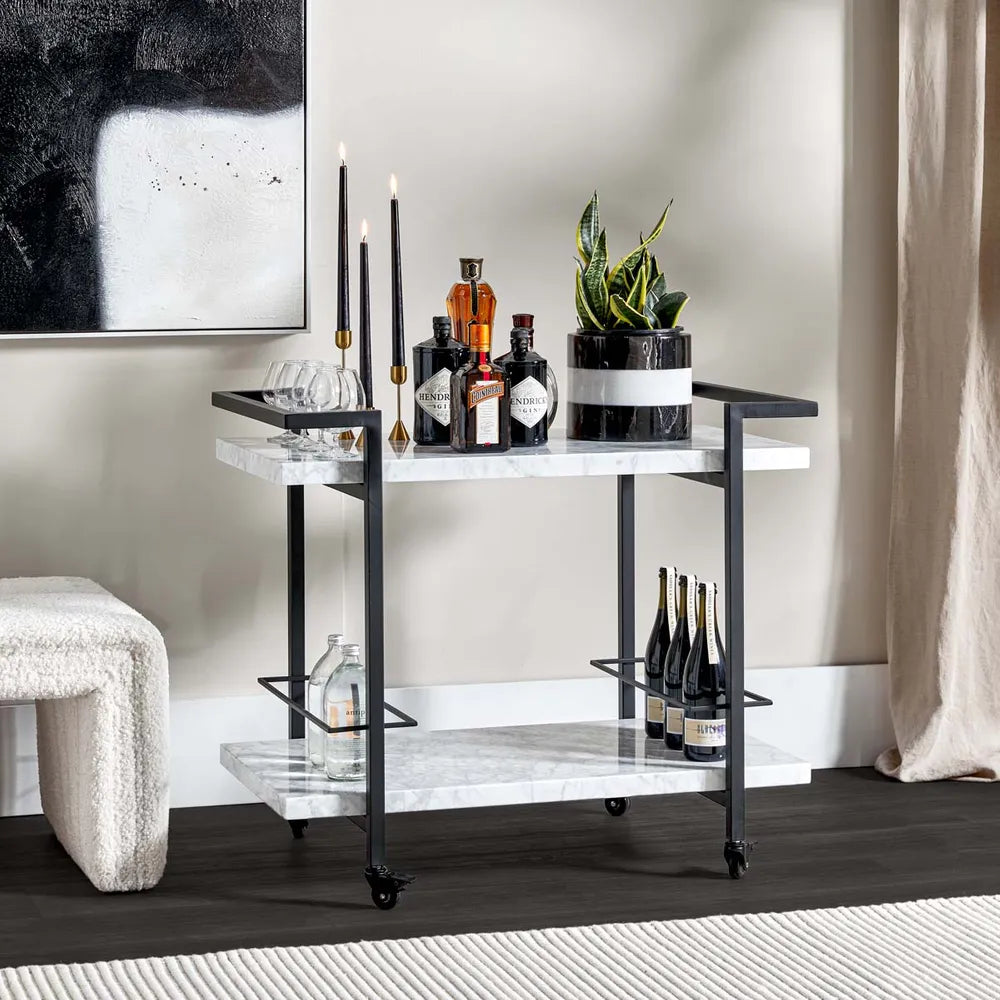 Modern bar cart with bottles and glasses in a stylish room.