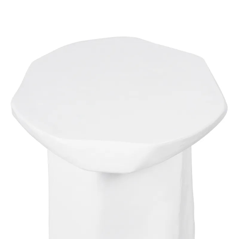 White concrete coffee table with an organic edge on a white background