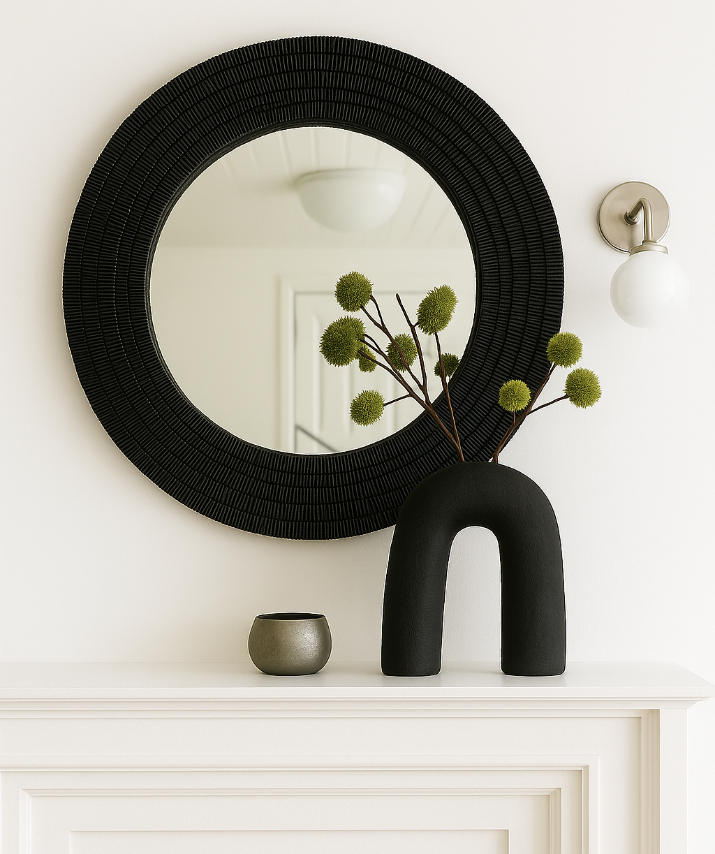 Round black mirror styled on white mantel