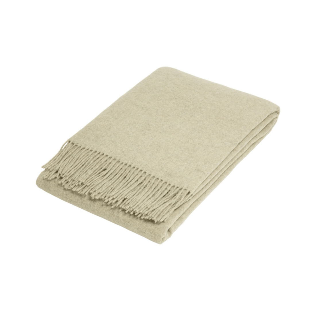 Stone folded wool blend throw rug on white background