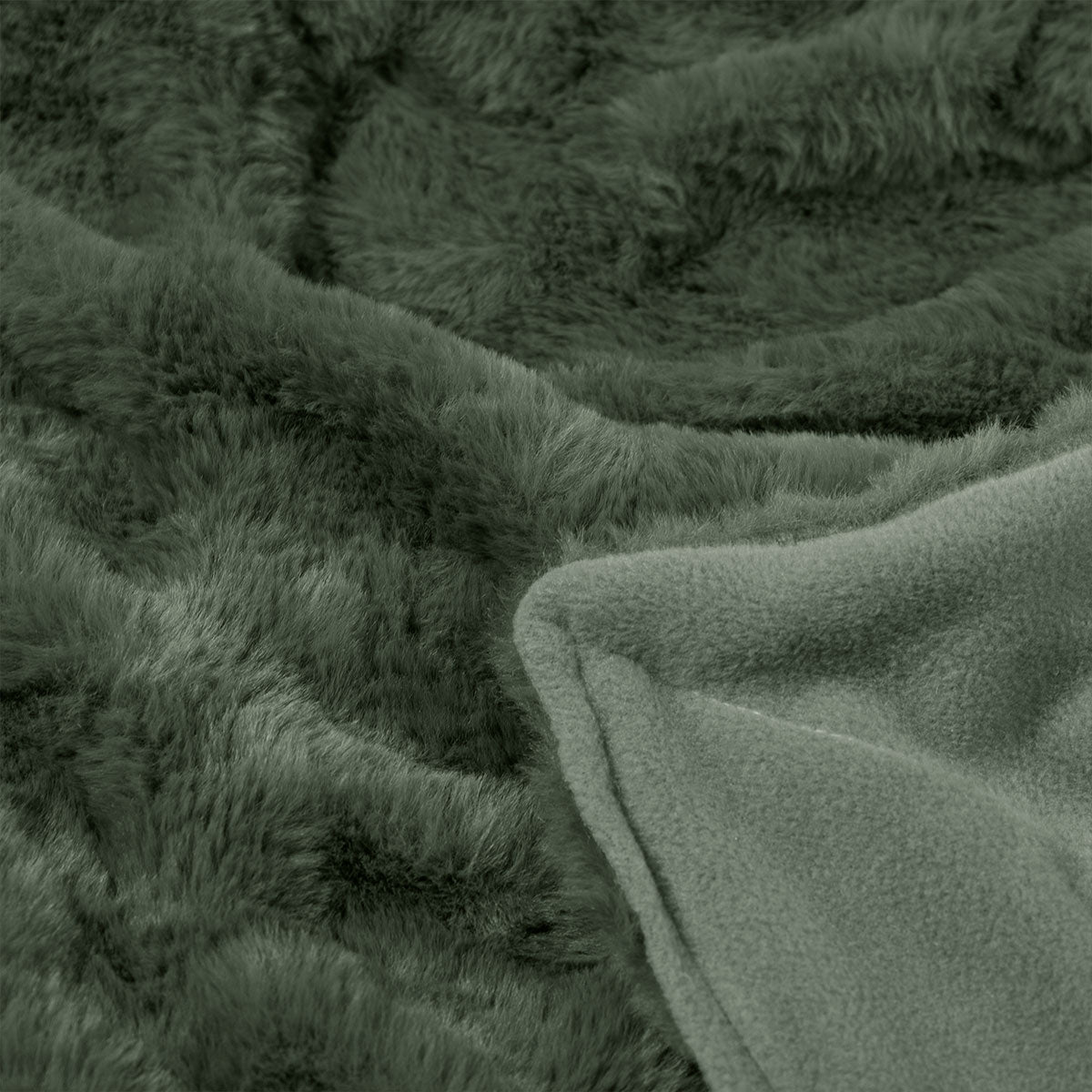 Close-up of green textured faux fur throw rug with a soft surface