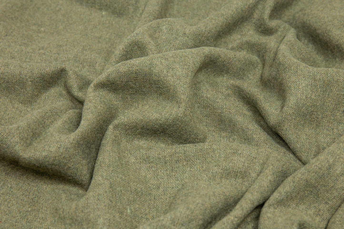 Close-up of green fabric with a textured pattern