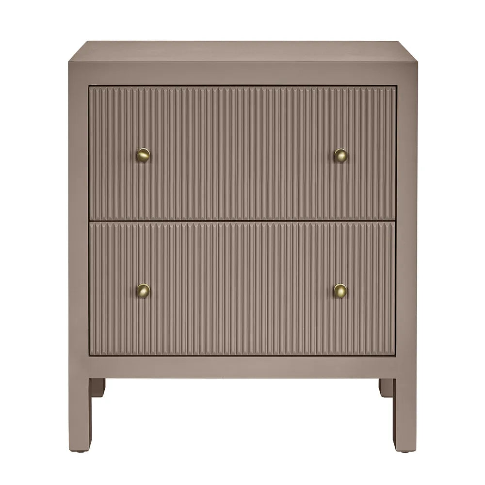 Beige side table with two drawers and brass knobs on a white background