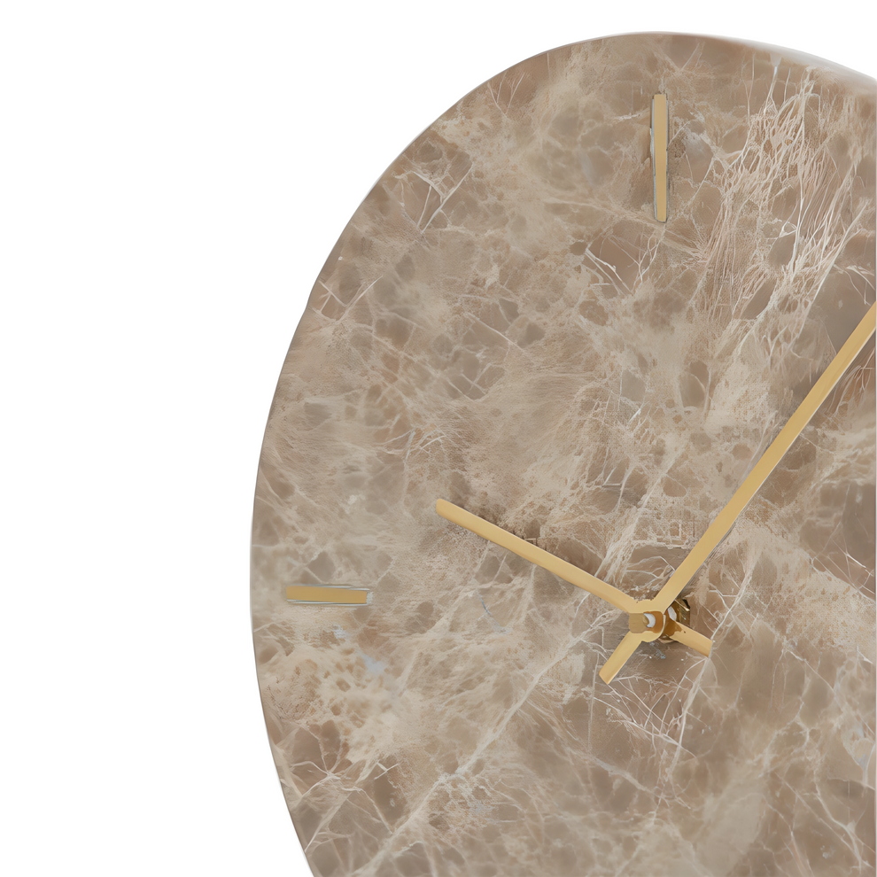 Marble-patterned wall clock with gold hands on a white background