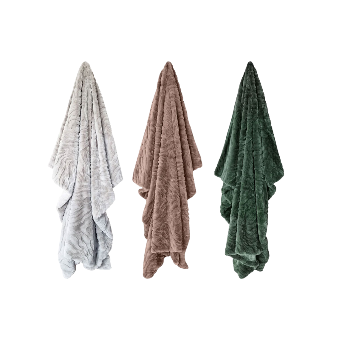 Three textured throw blankets in silver grey, mink brown, and forest green on a white background
