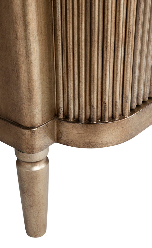close up of gold bedside table leg
