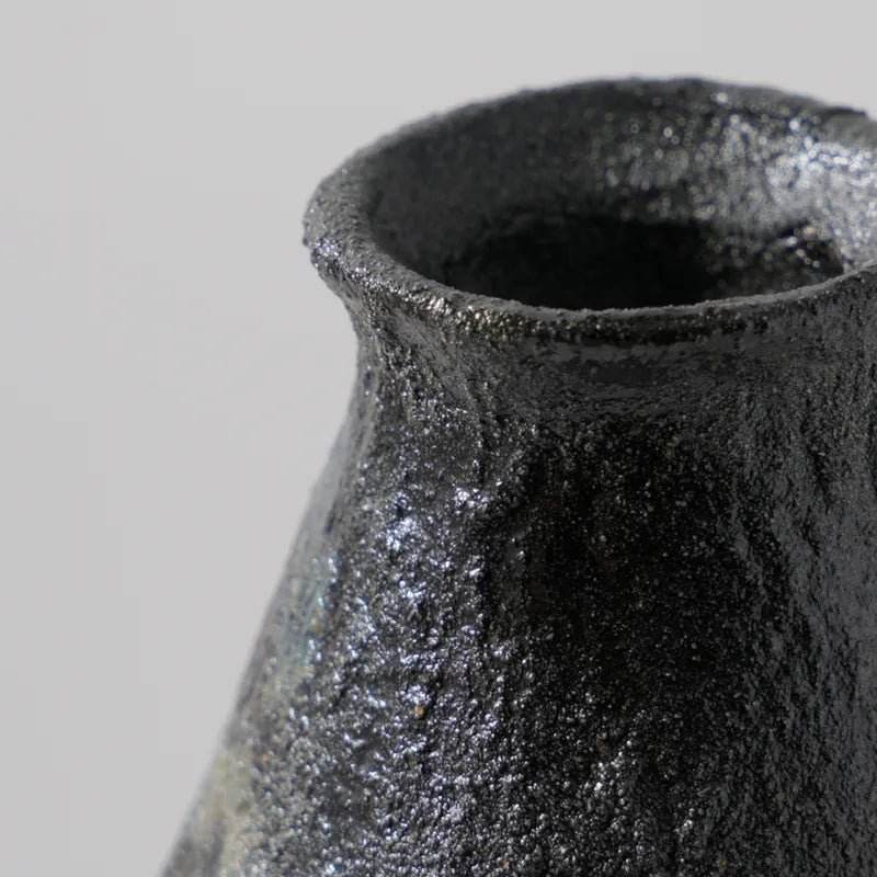 Close-up of a large textured vase for sale featuring a unique finish and artistic design