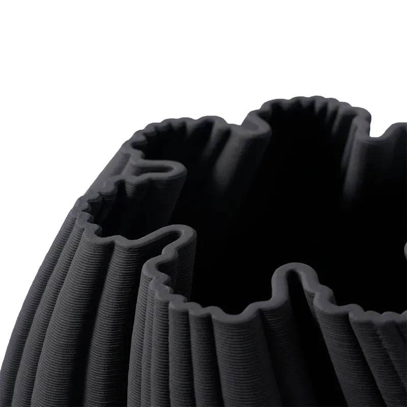 Mirra Interiors Black modern twist vase decor with a sculptural design, perfect for contemporary interiors