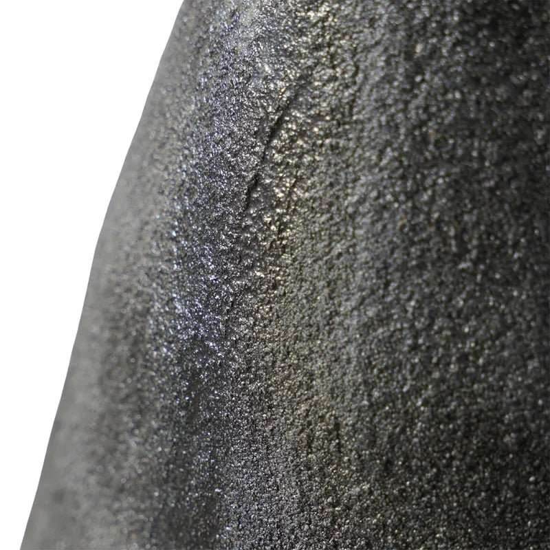 Textured black porcelain vase by Mirra Interiors showcasing a unique surface design