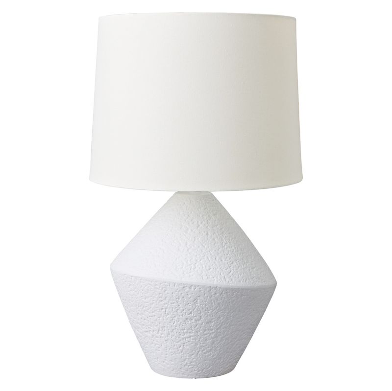 White textured table lamp with a white shade on a white background