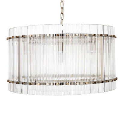 A round fluted glass pendant light with a brass frame and iron bulb fitting | Mirra Interiors