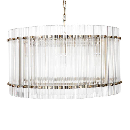 A round fluted glass pendant light with a brass frame and iron bulb fitting | Mirra Interiors