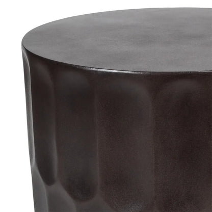 Round bronzed black side table stool with a glossy finish on a white background