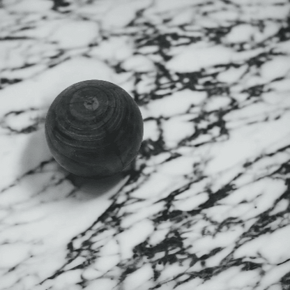 Wooden Black Styling Ball on white and black Marble Counter for Mirra Interiors