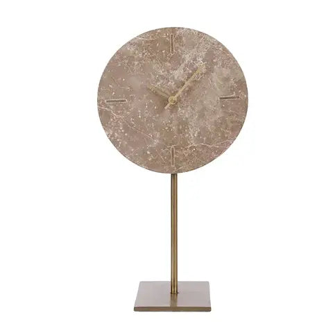 Marble-patterned clock on a stand with a white background