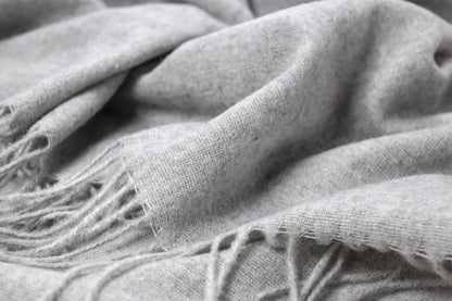 Close-up of a textured gray fabric with fringes