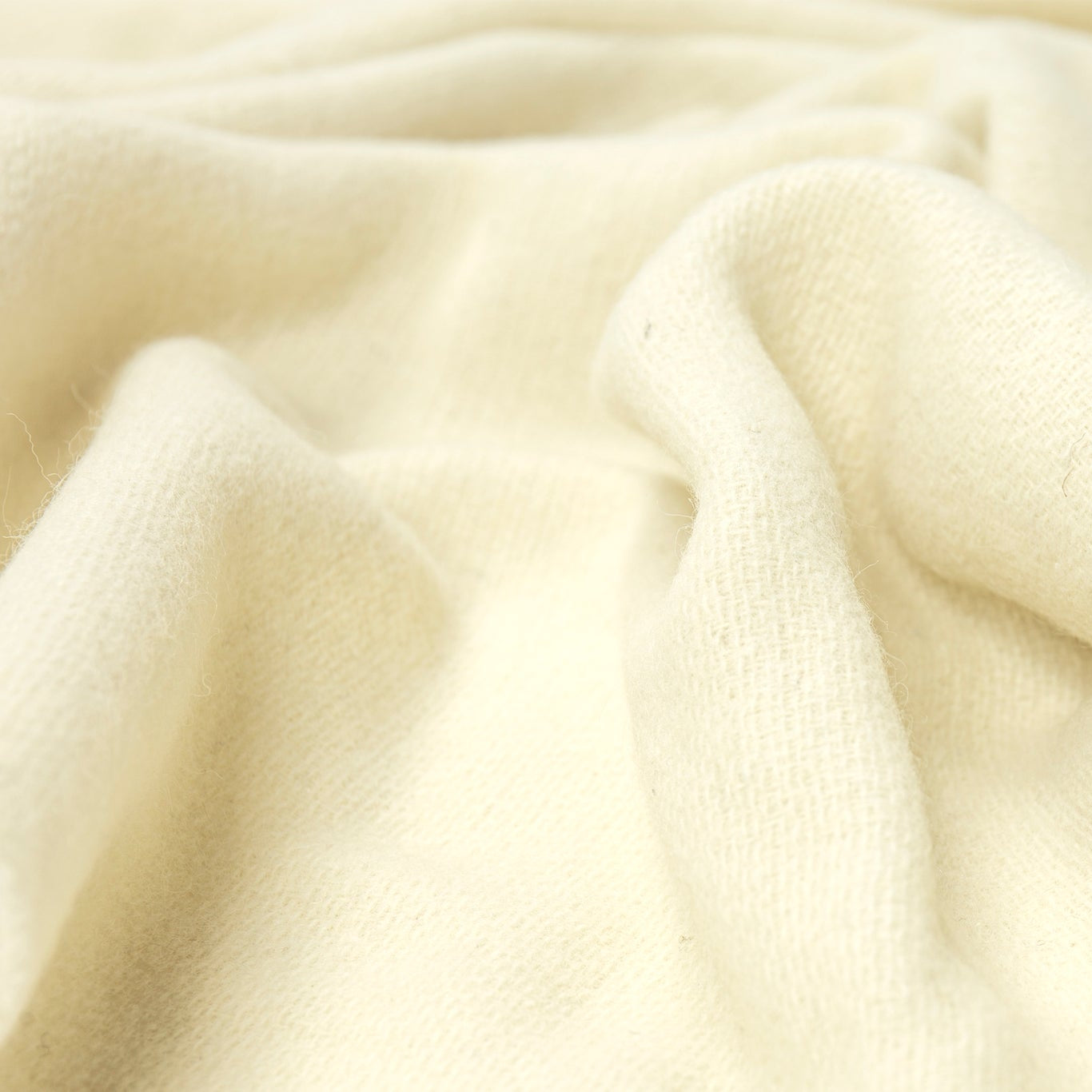 Close-up of ivory throw rug with soft texture