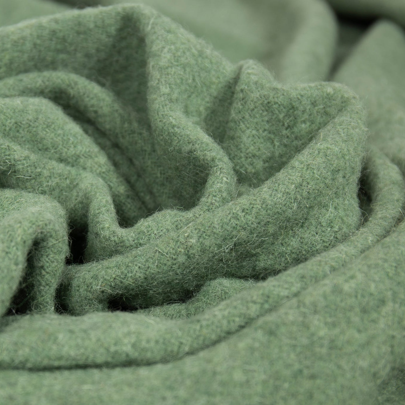 Close-up of green throw with folds