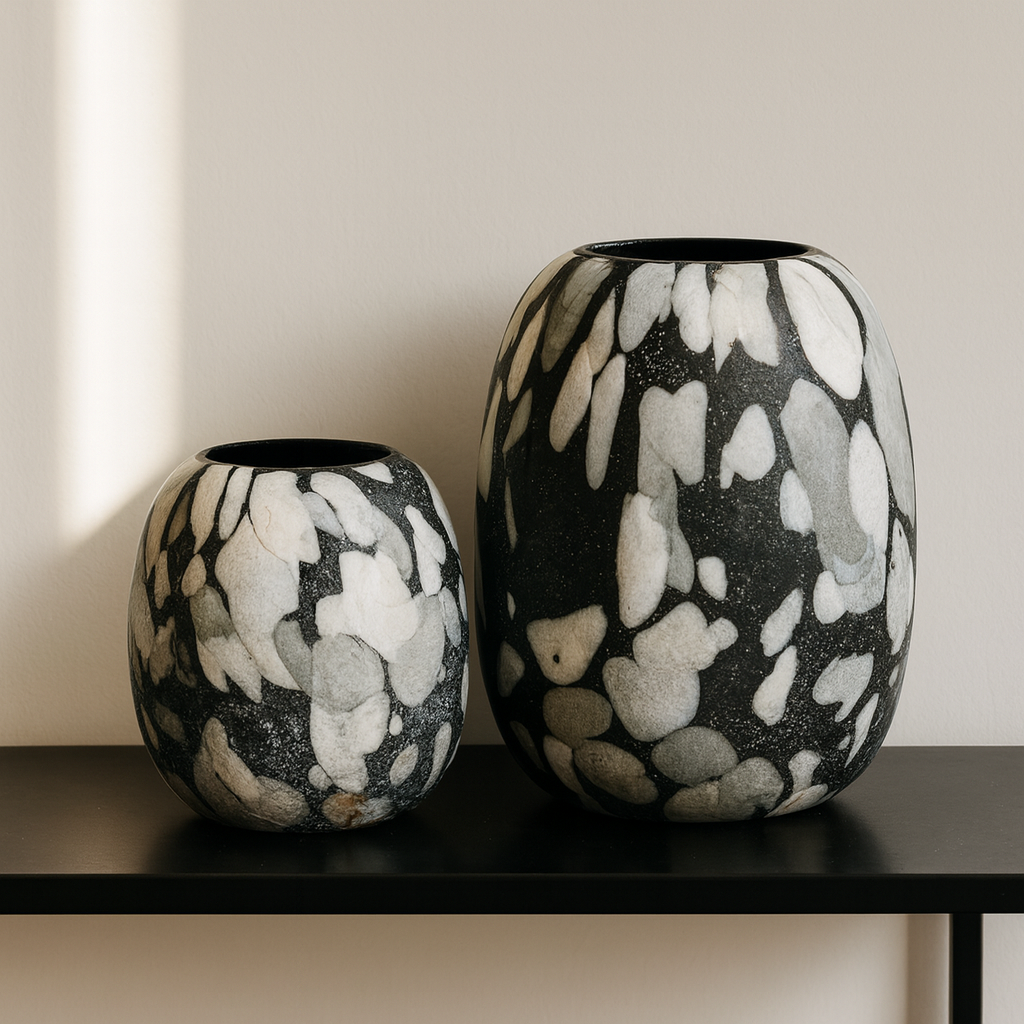 Two decorative vases with black, white, and gray pattern on a neutral background