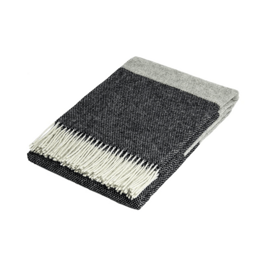 charcoal and grey striped wool throw folded on white background | mirra interiors