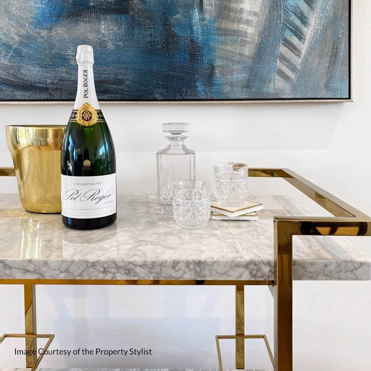 Styled image of a drinks trolley with wine and glasses by The Property Stylist