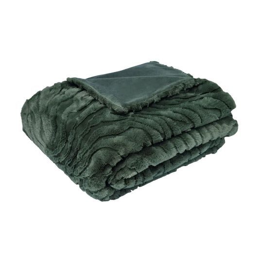 Folded green blanket on a white background | Mirra Interiors