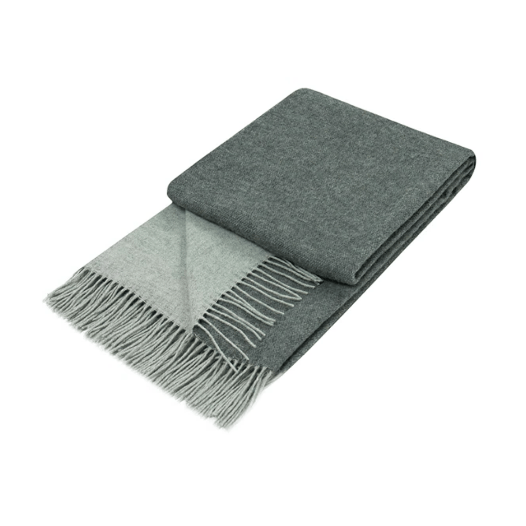 charcoal throw rug folded on white background
