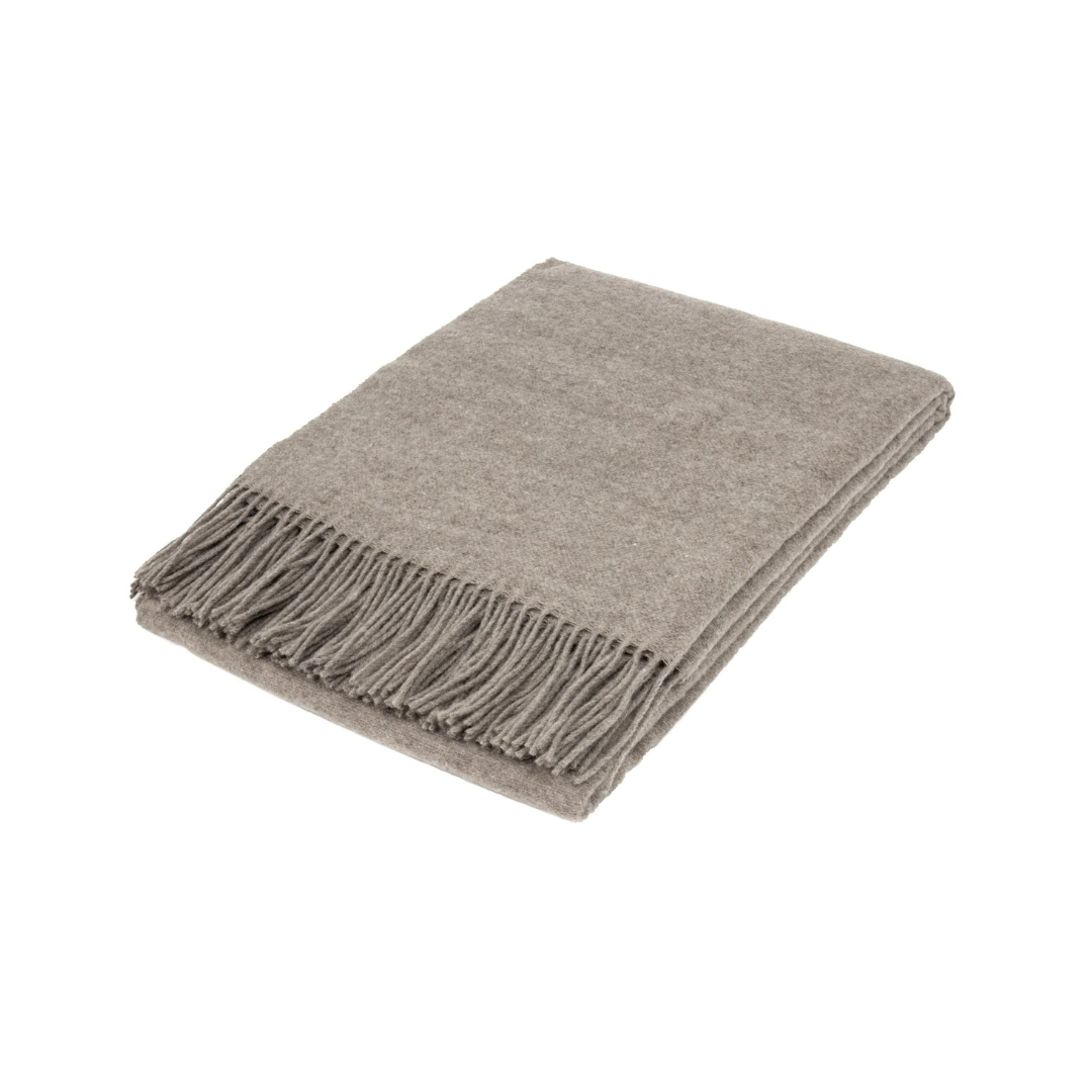 natural mink brown wool blend throw with fringes folded on white background | Mirra Interiors