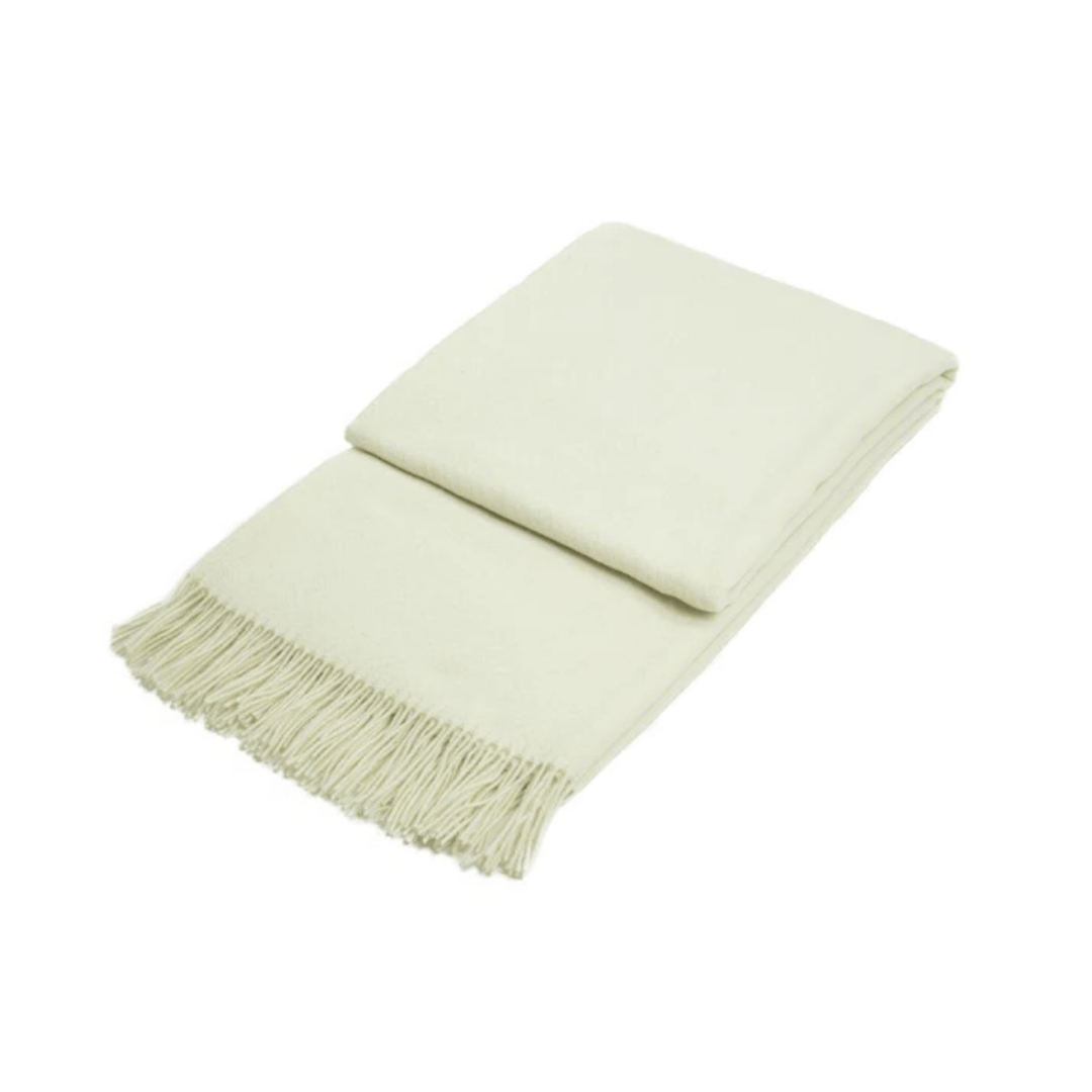 white ivory folded wool throw on white background