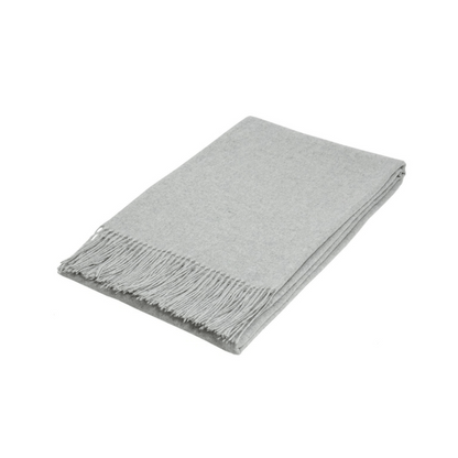 light grey silver folded wool textured throw rug on white background