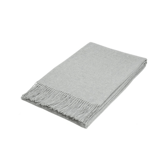 light grey silver folded wool textured throw rug on white background