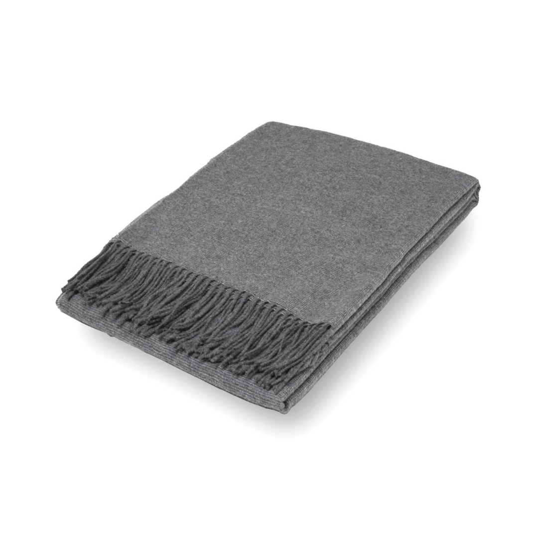 slate folded textured wool throw rug on white background