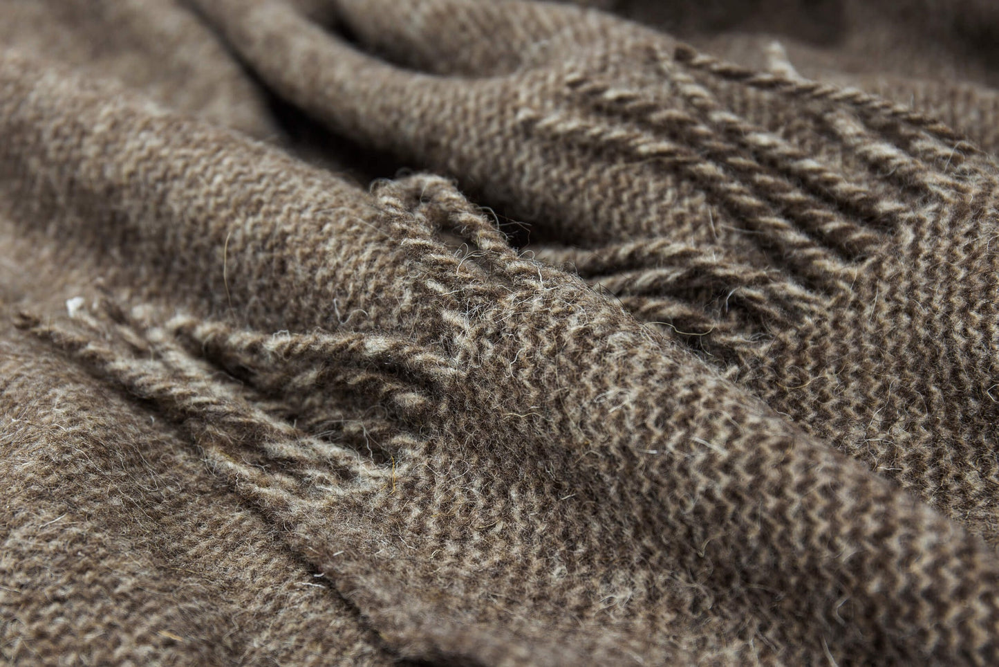 Close-up of brown throw with texture and wear