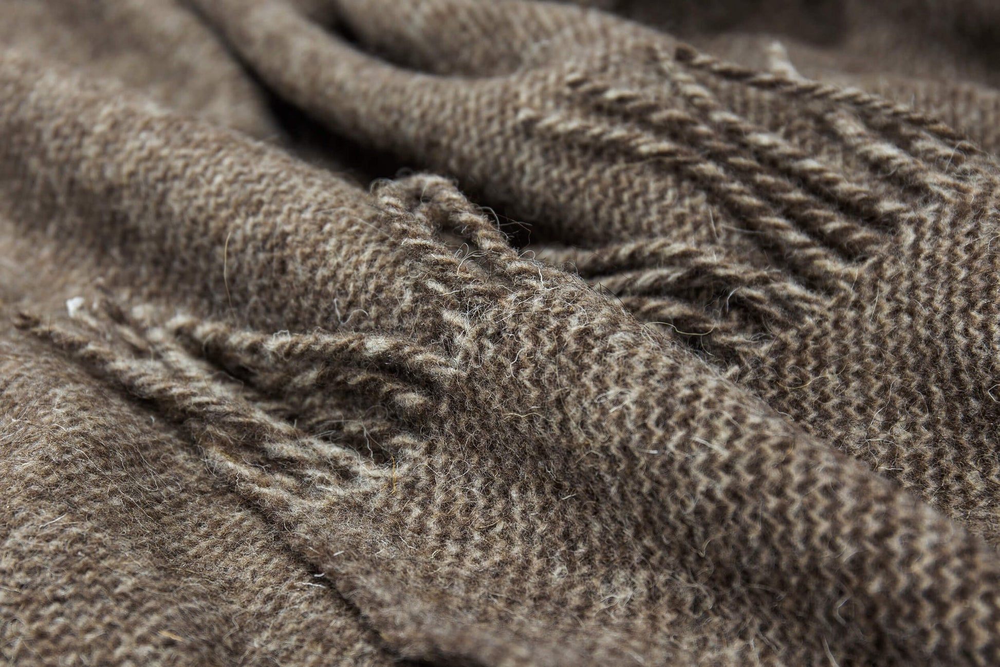 Close-up of brown throw with texture and wear