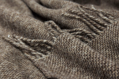 Close-up of brown throw with texture and wear