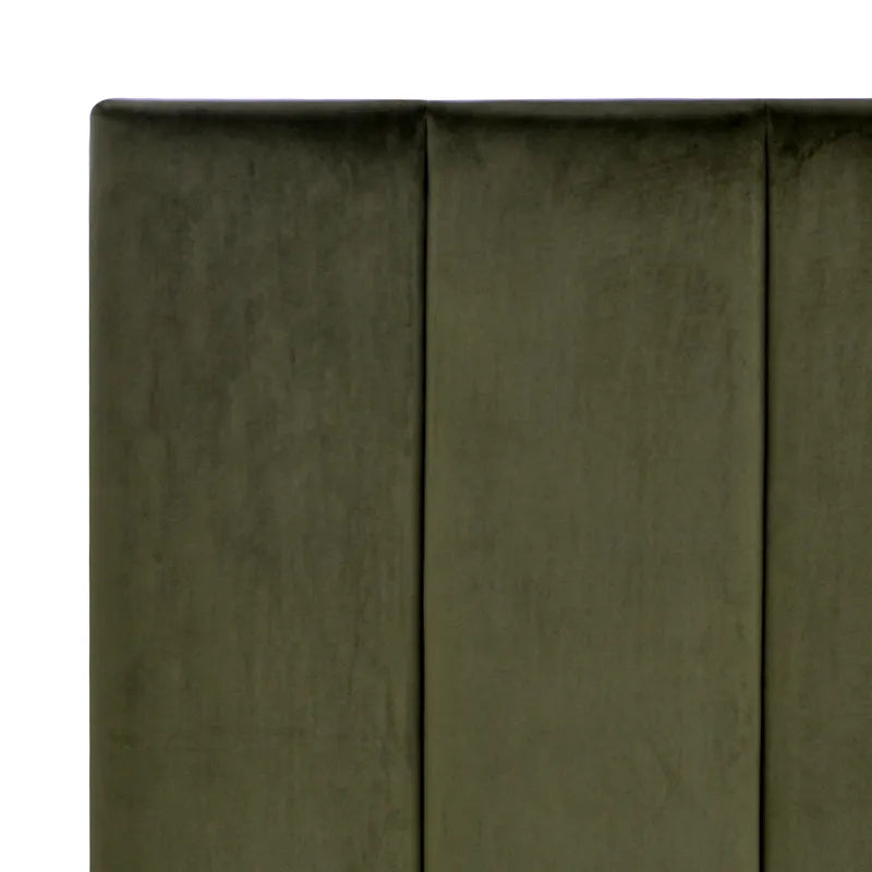 Close-up of a green fabric surface with a subtle pattern