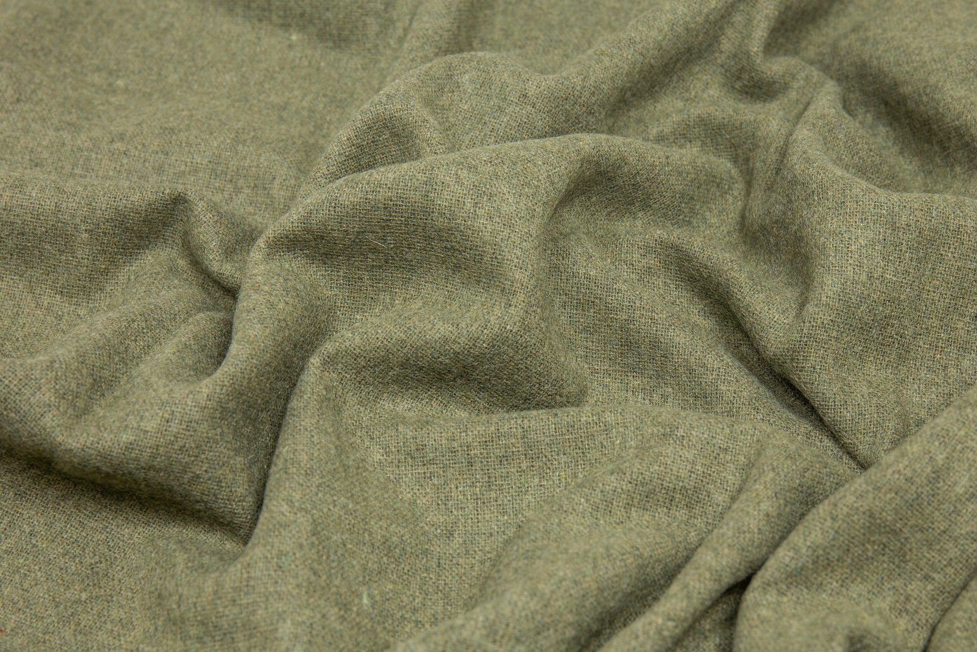Close-up of green fabric with a textured pattern