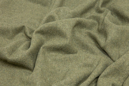 Close-up of green fabric with a textured pattern
