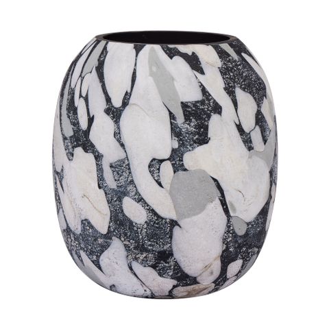 Decorative vase with black and white abstract pattern on a white background