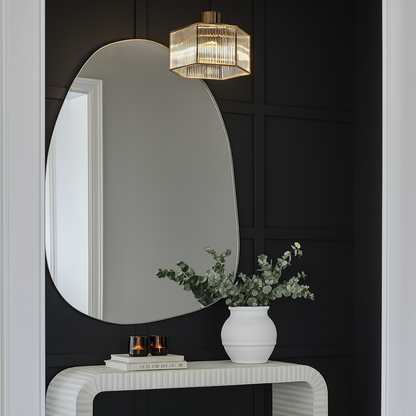 Pebble mirror styled on black feature wall entry