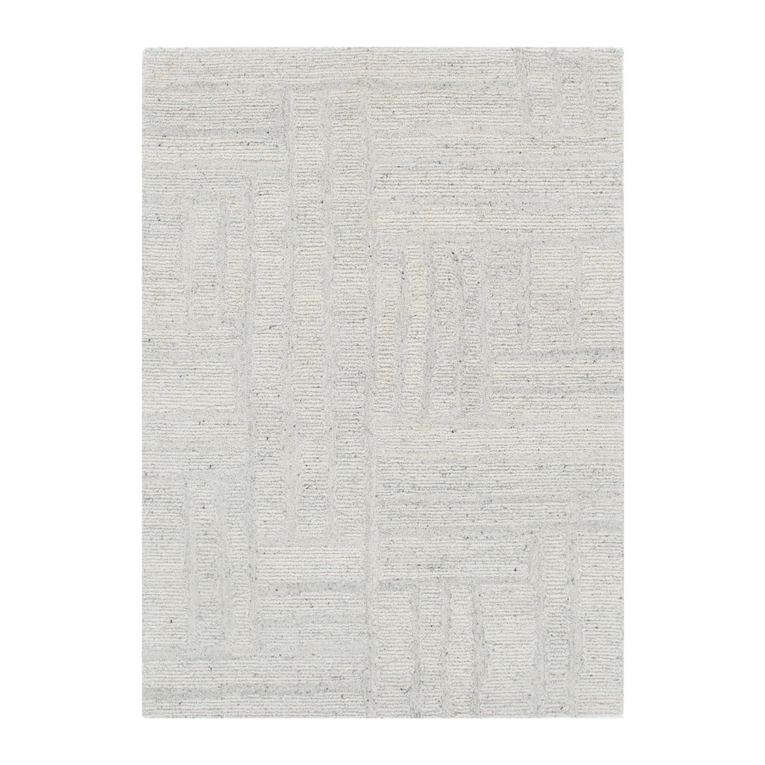 Textured grey rug on a white background