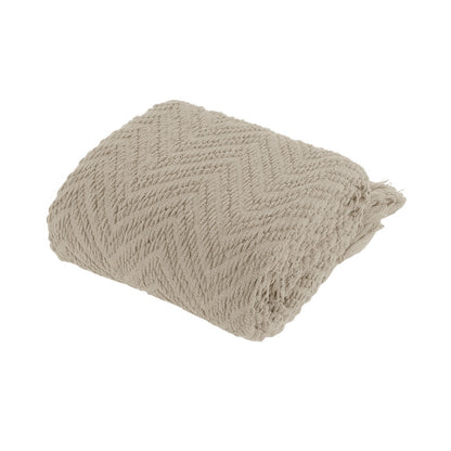 Beige textured throw blanket on a white background | Mirra Interiors