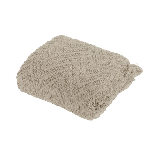 Beige textured throw blanket on a white background | Mirra Interiors