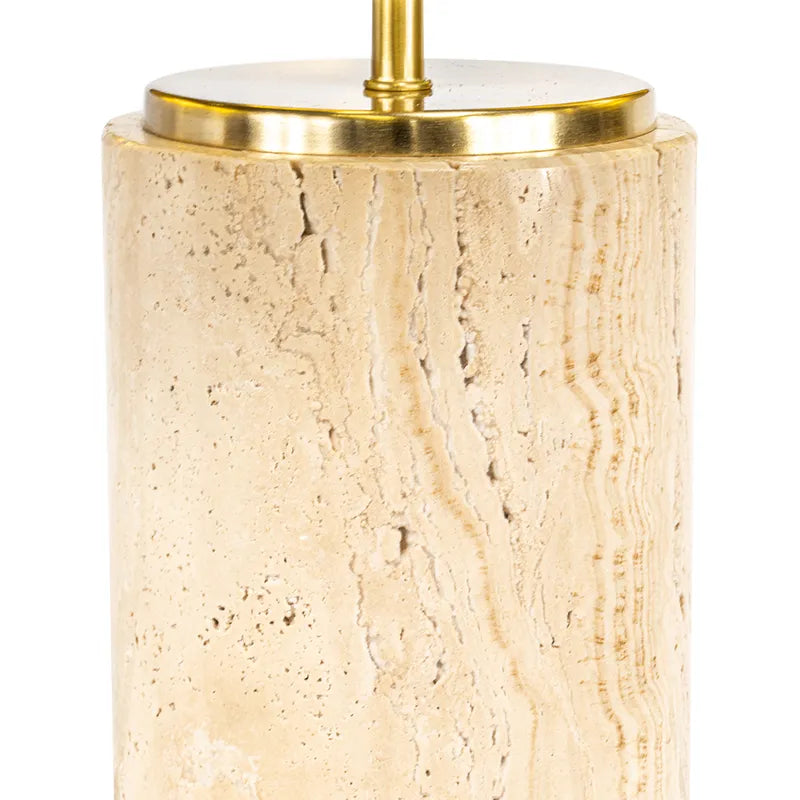 Beige travertine table lamp with gold base on a white background