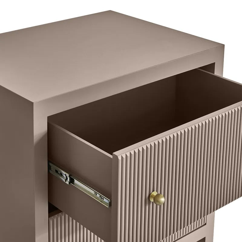 Beige side table with open drawer and decorative handle on a white background
