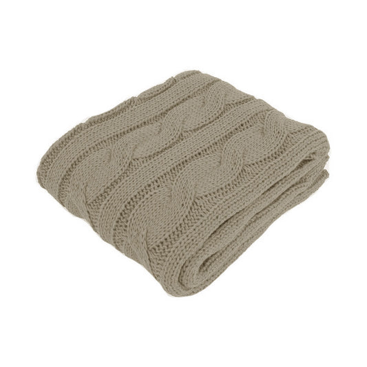 Folded beige knitted blanket on a white background | Mirra Interiors