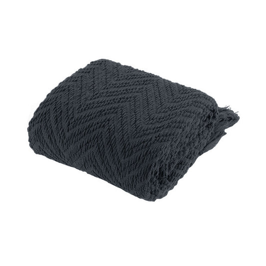 Dark gray knitted blanket on a white background | Mirra Interiors
