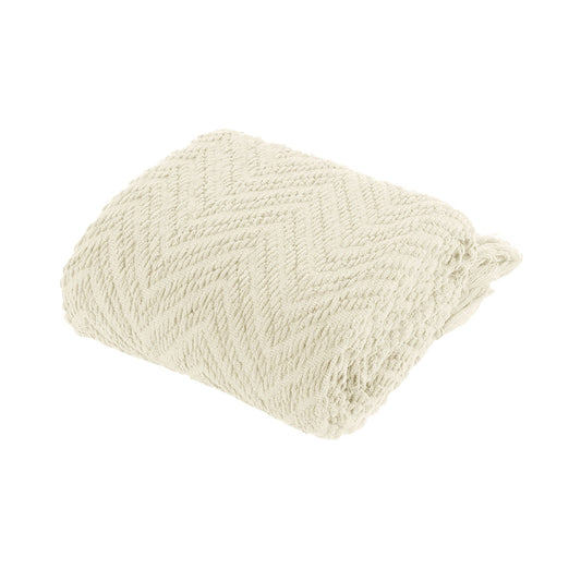 Cream textured throw rug on a white background | Mirra Interiors