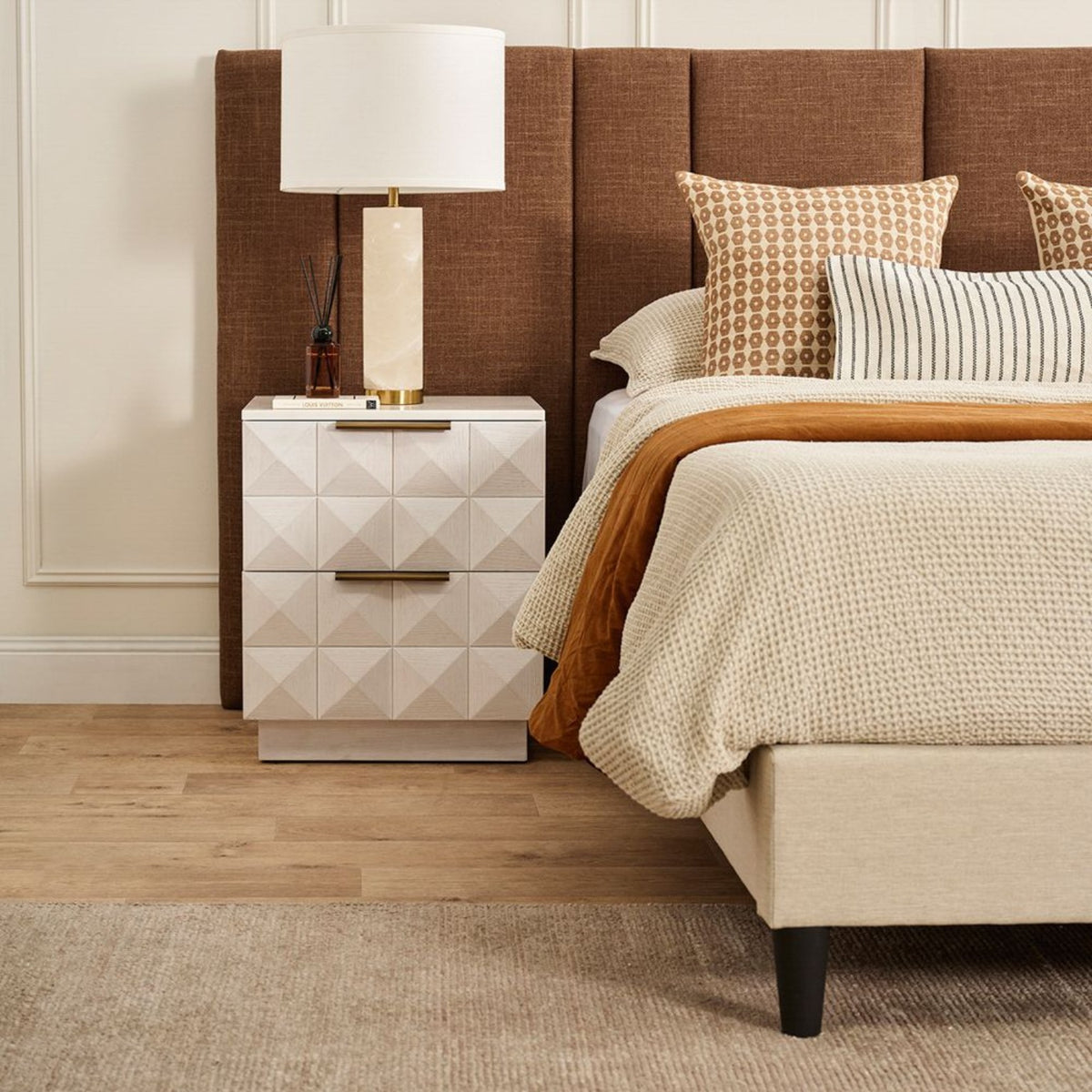 Elowen alabaster table lamp beside a bed