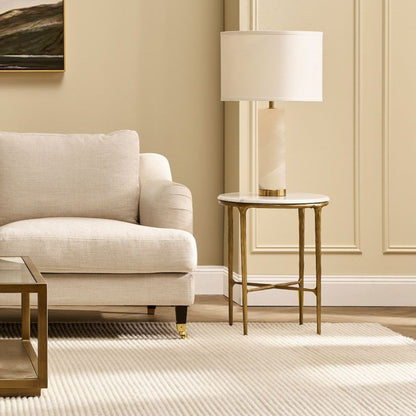 Elowen alabaster table lamp styled beside an armchair